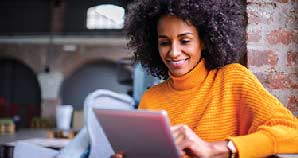 Young woman checking her estatement on her tablet.