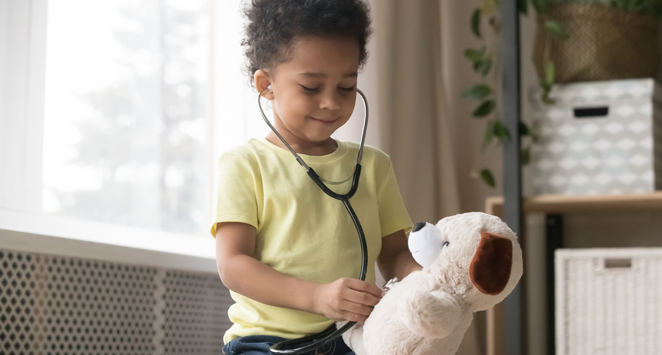 HSA Homepage Banner photo Child holding stethoscope to Teddy Bears chest